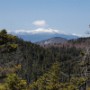 A puff of clouds hovering above Mt Washington.